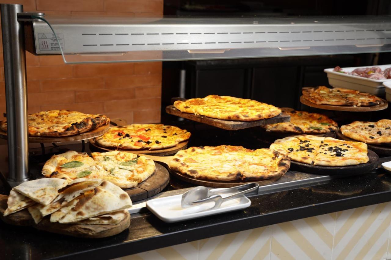 The Mirage Resort & Spa Hammamet Exterior photo A display of pies at a bakery